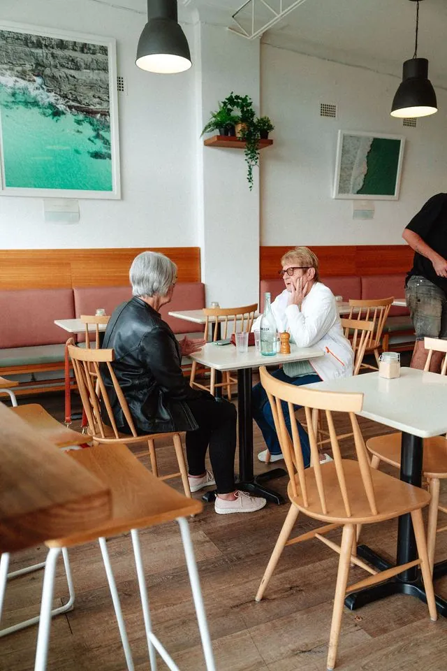 Families sharing a meal inside Playground Cafe